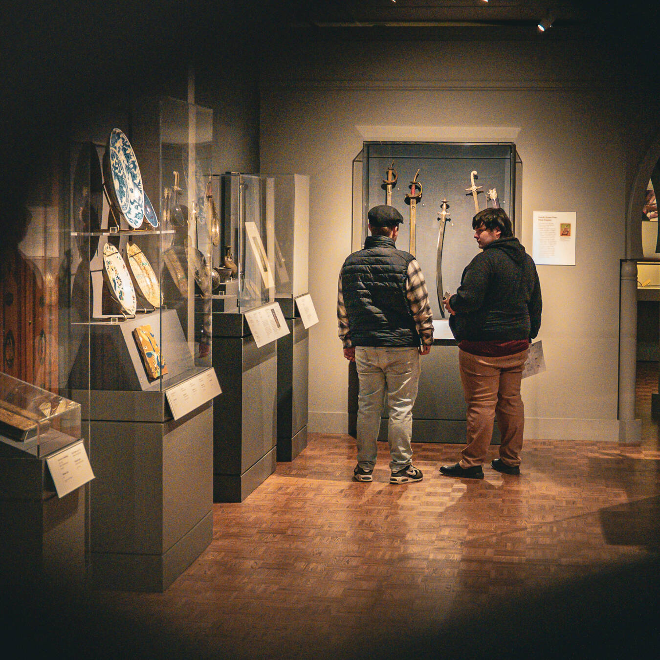 Two students exploring artifacts in the DIA.